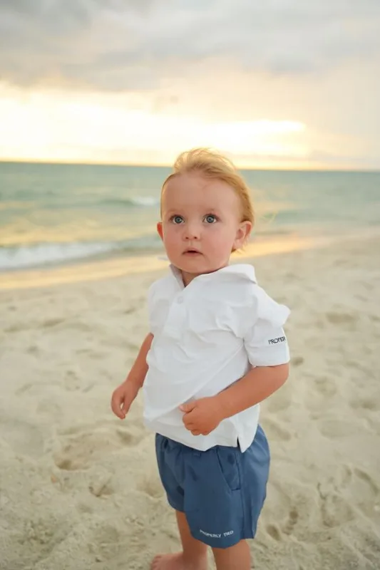 Toddler playing by the ocean, photographed by Miranda Rae