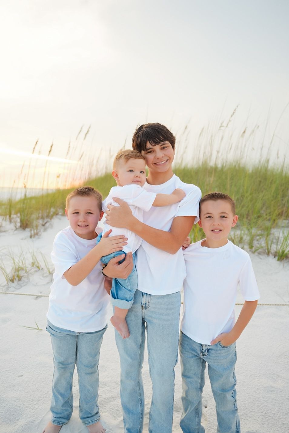 Brothers smiling together in the dunes